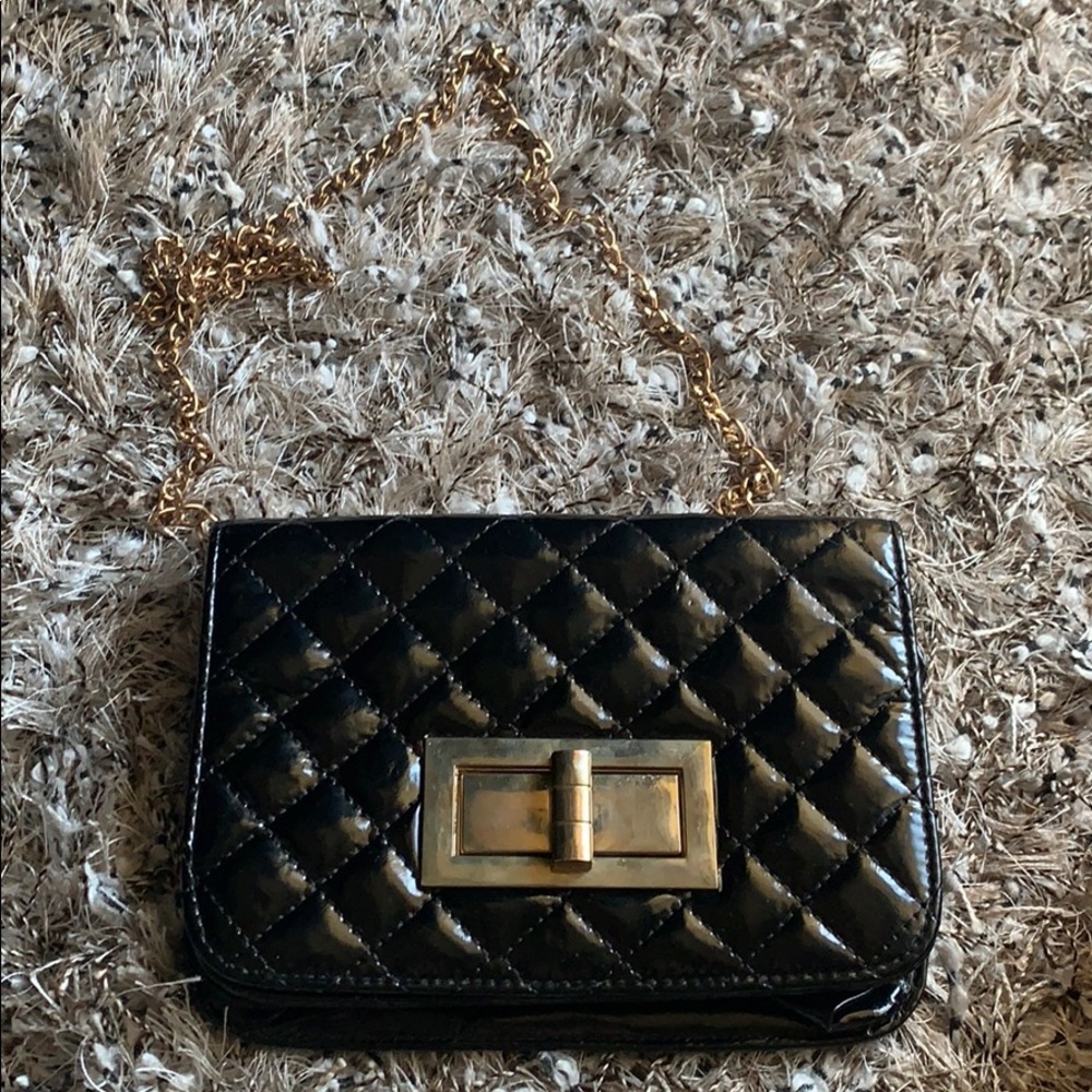 Black and gold patent leather‎ bag